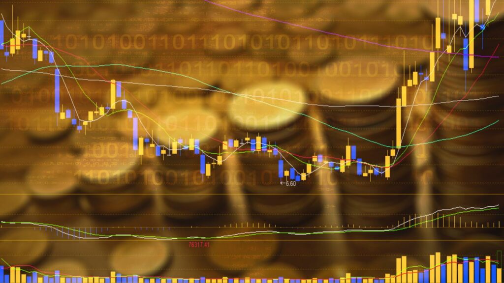 A digital stock market graph with colorful candlesticks and trend lines is overlaid on a blurred background of stacked gold coins, symbolizing financial growth and investment. Binary numbers are faintly visible across the image.