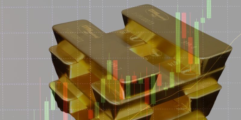 Le pile di lingotti d'oro sono mostrate con i grafici finanziari a candela sovrapposti, che illustrano l'intersezione tra l'investimento in oro e i dati di mercato.